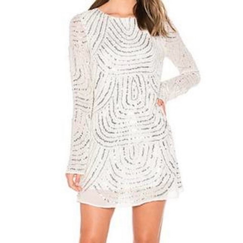 Show me your MUMU Iggy dress size S with all
Over sequin pattern